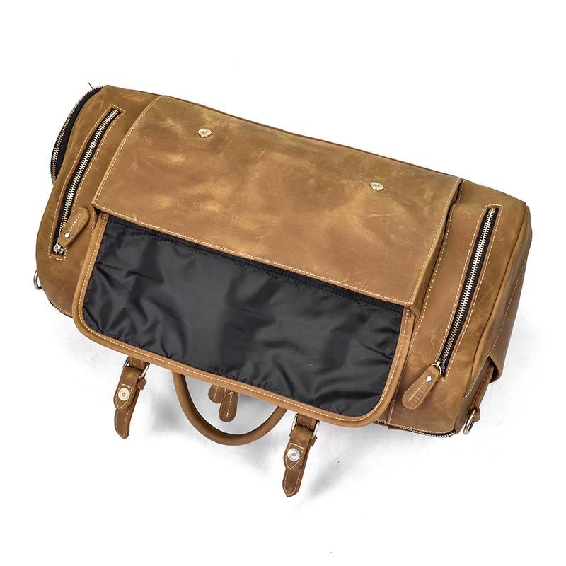 Leather duffle bag with back flap panel and zippered pocket with black lining