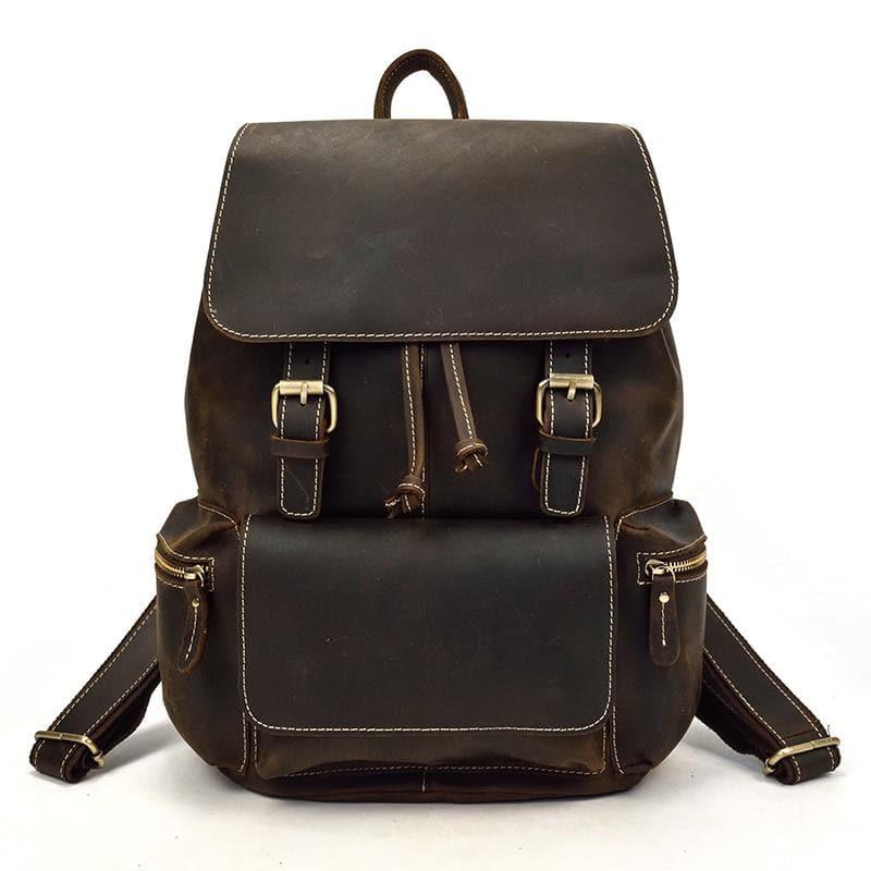 Vintage leather backpack with flap front, drawstring, and shoulder straps, dark brown