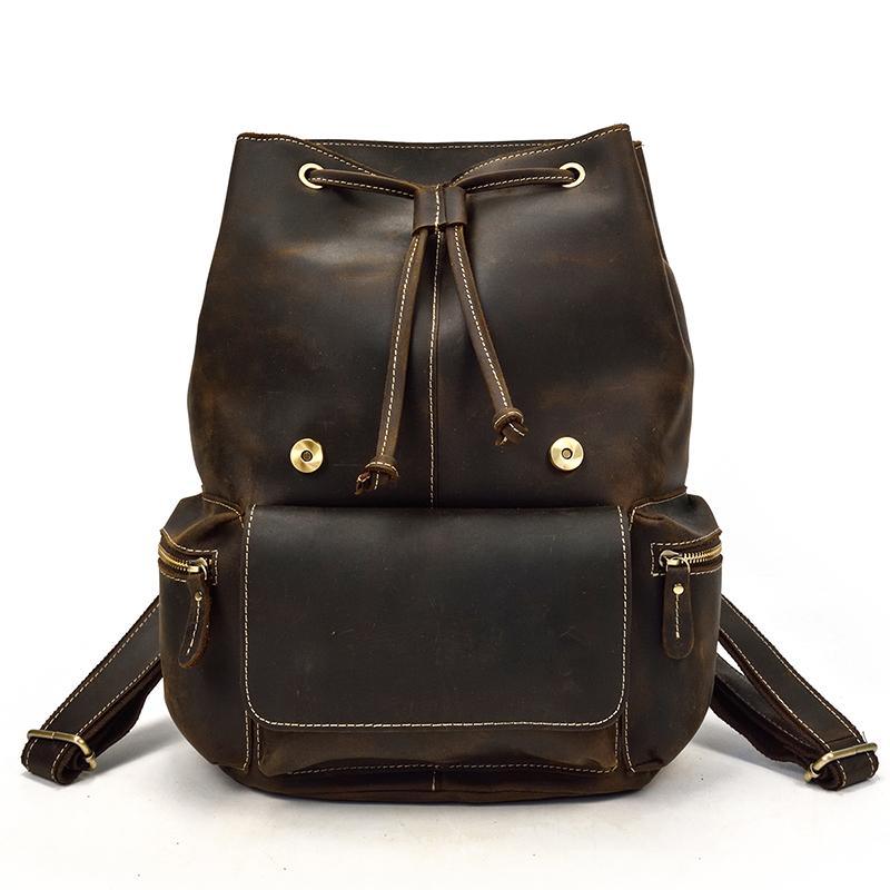 Vintage leather backpack with drawstring closure and front pocket, dark brown leather