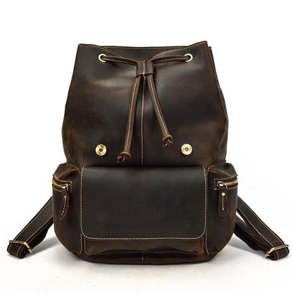 Vintage leather backpack with drawstring closure and front pocket, dark brown leather