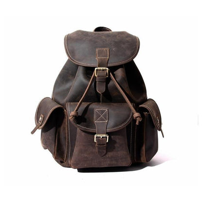 Genuine leather rucksack in dark brown with front flap, buckles, and side pockets