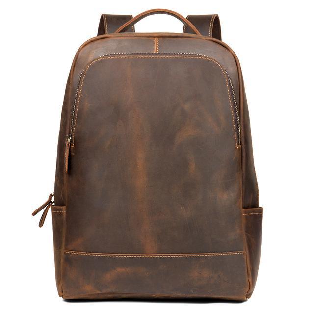 Vintage brown leather minimalist backpack with top handle and front zipper