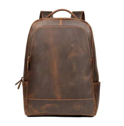 Vintage leather minimalist backpack in dark brown with top handle and front zipper
