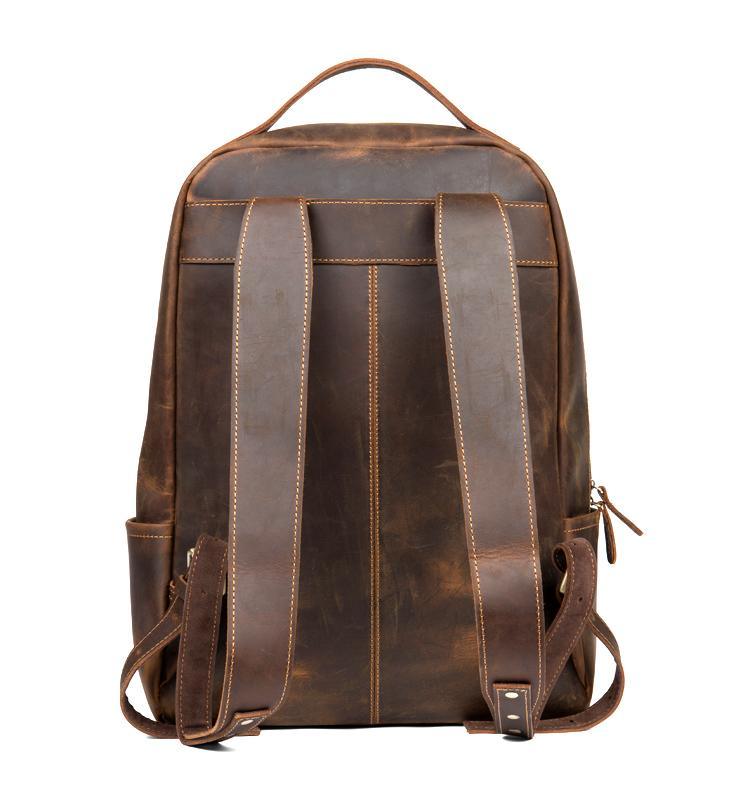 Vintage brown leather backpack with adjustable shoulder straps and front zipper