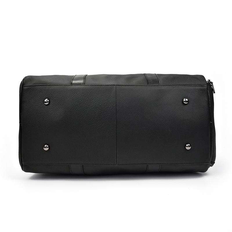 Black leather weekender duffle bag back panel with snap hardware and seam details.