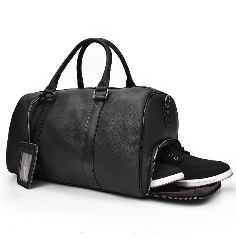 Black leather weekender duffle bag with side zipper and built-in shoe compartment.