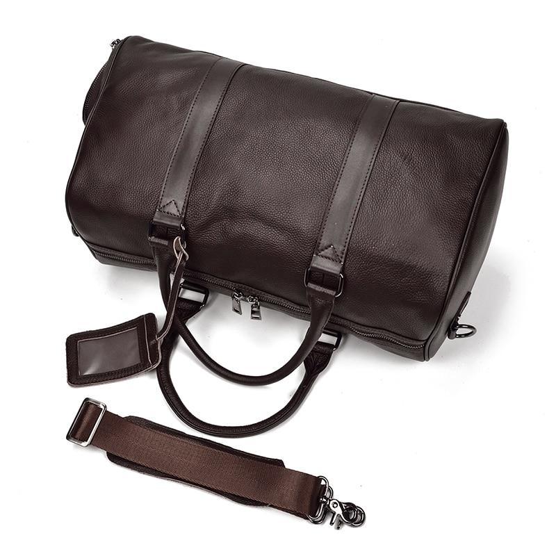 Brown leather weekender duffle bag with crossbody strap, front flap pocket, and zipper.