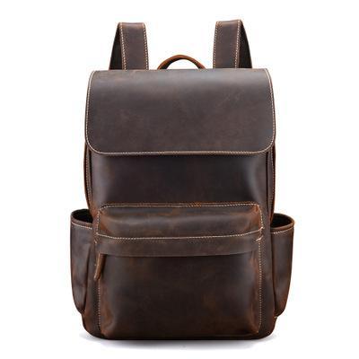 Vintage leather laptop backpack in dark brown, front flap and stitched pocket.