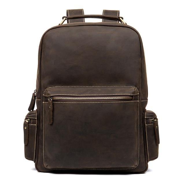 Dark brown vintage leather backpack with top handle, front zip pocket, and adjustable straps.