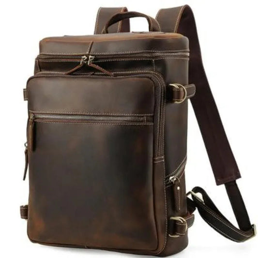 Vintage cow leather backpack, side profile with front zipper pocket and adjustable strap