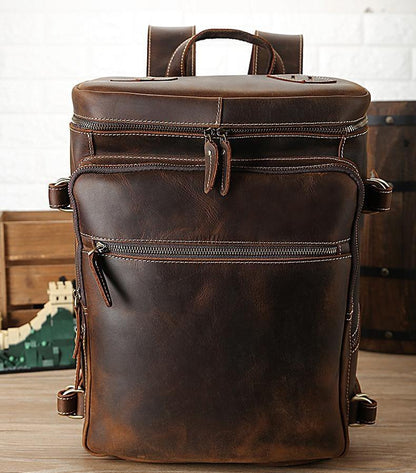 Vintage cow leather backpack, front view with two zip compartments and crossbody straps
