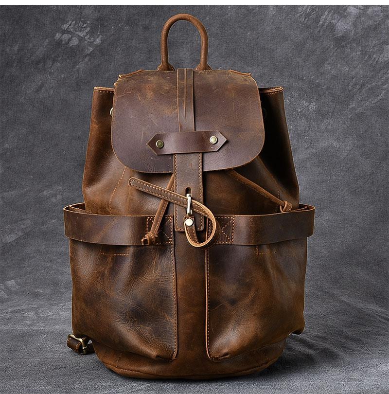 Vintage leather travel backpack with top flap and dual front pockets