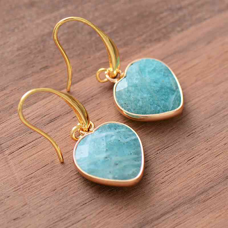 Natural Stone Heart Drop Earrings on a wood table