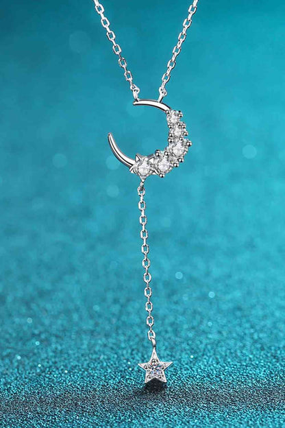 Star & Moon Moissanite Necklace with blue background