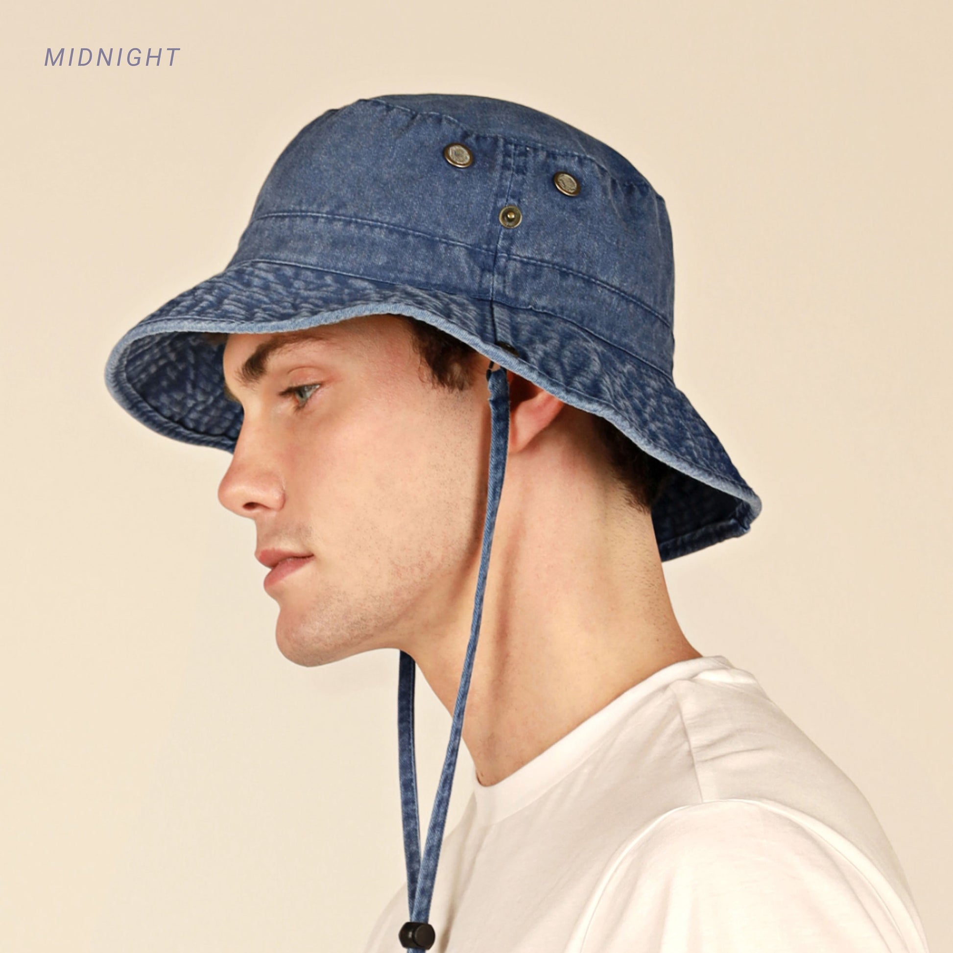 Model wearing the midnight Cotton String Bucket Hat