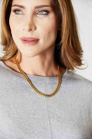Curb Chain Stainless Steel 18 Karat Gold Plated Necklace on a woman's neck
