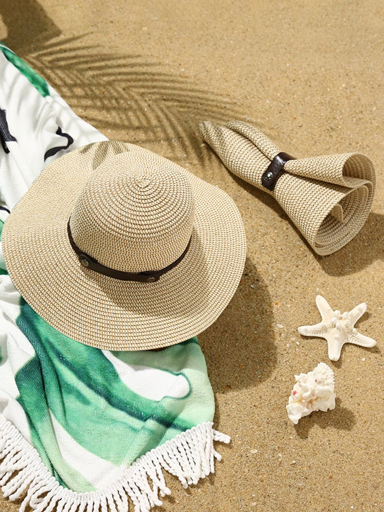 Women's Straw Floppy Sun Hat on the beach sand