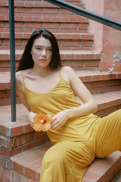 Women's Honey Yellow Jumpsuit, model on the ground