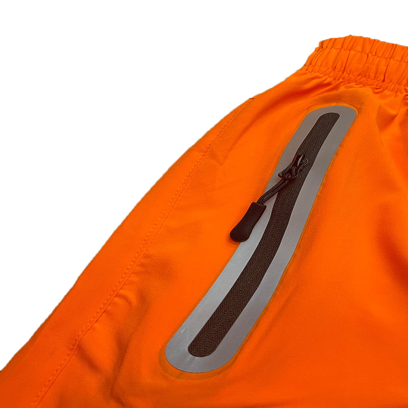 Picture of a Men's Performance Orange Running Shorts close up of a zipper