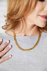 Curb Chain Stainless Steel 18 Karat Gold Plated Necklace on a woman