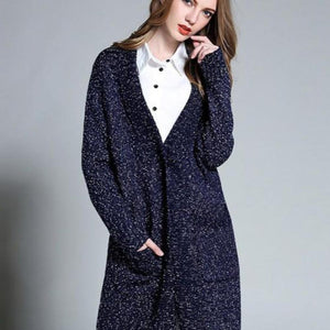 Picture of a Women's Navy Blue Long Cardigan close up of buttoned view mid section on model