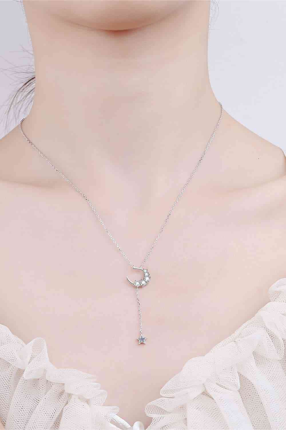 Star & Moon Moissanite Necklace on a woman's neck