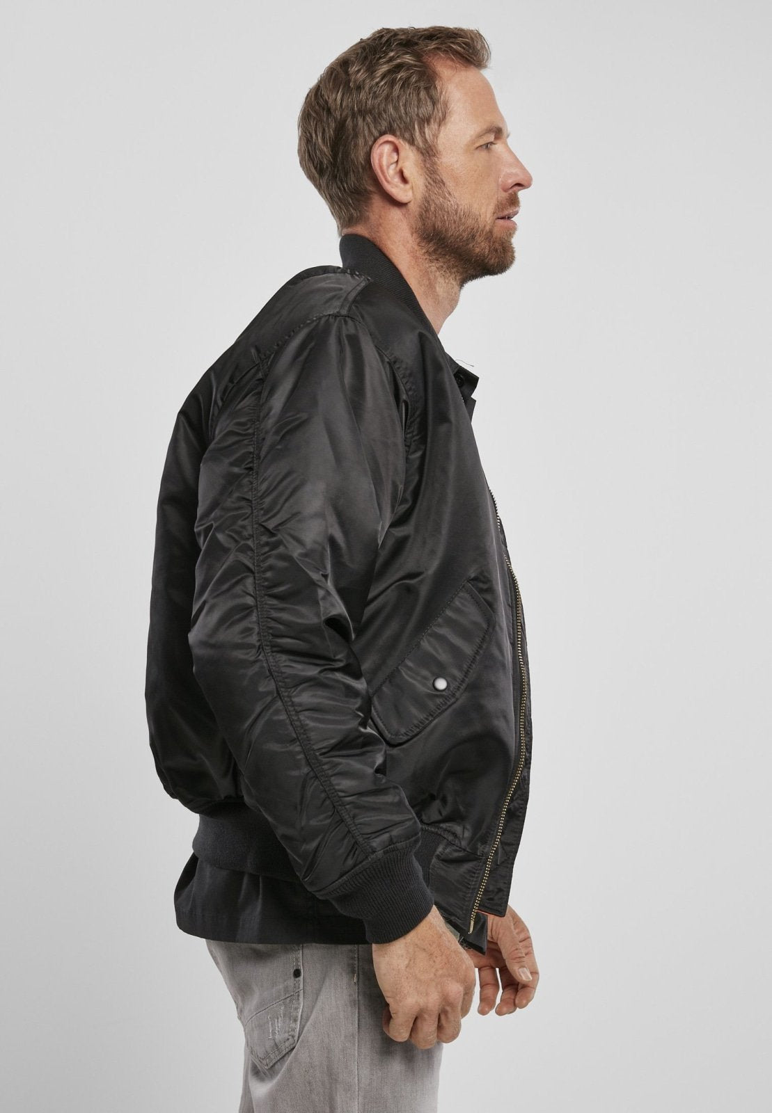 Picture of a Men's MA1 Nylon Bomber Jacket side view of the black color